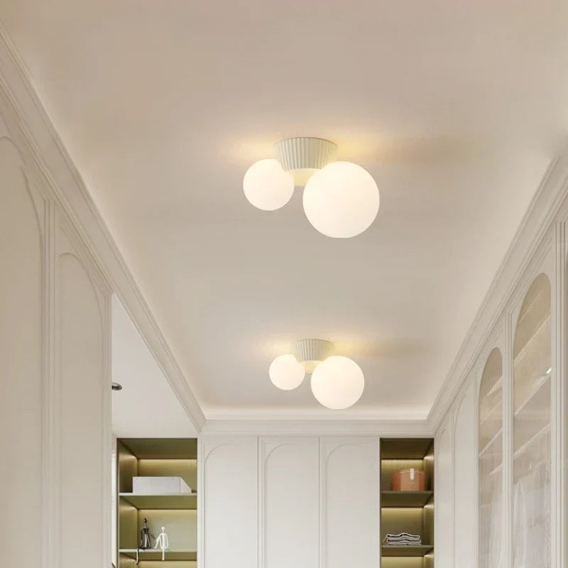 Plafonnier Luméa | Double globe en verre, 4 coloris