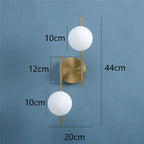 Applique Astra | Doré géométrique, 1 ou 2 globes dépolis